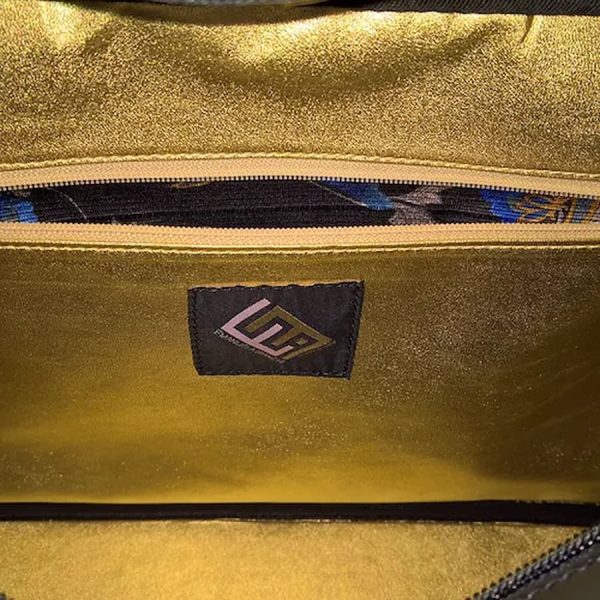 Bag in silk and petroleum green leather inside